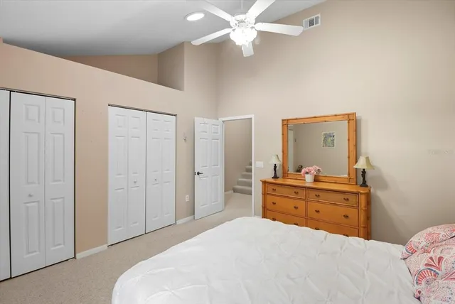 a room with a bed and a dresser