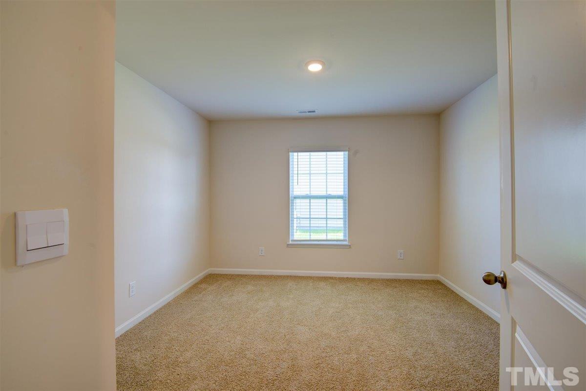 7653 Sand Pit Road Stantonsburg, NC 27883 - Photo 12 of 28 an empty room with a window