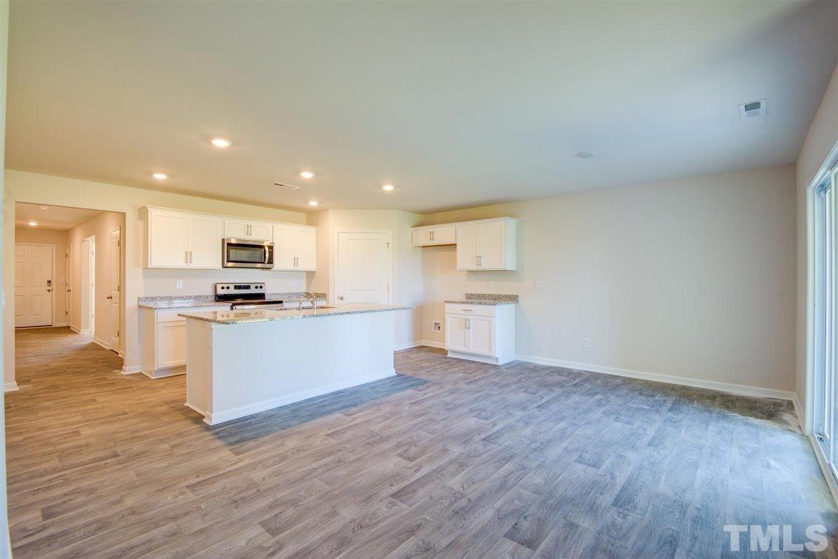 7653 Sand Pit Road Stantonsburg, NC 27883 - Photo 21 of 28 a view of kitchen with wooden floor