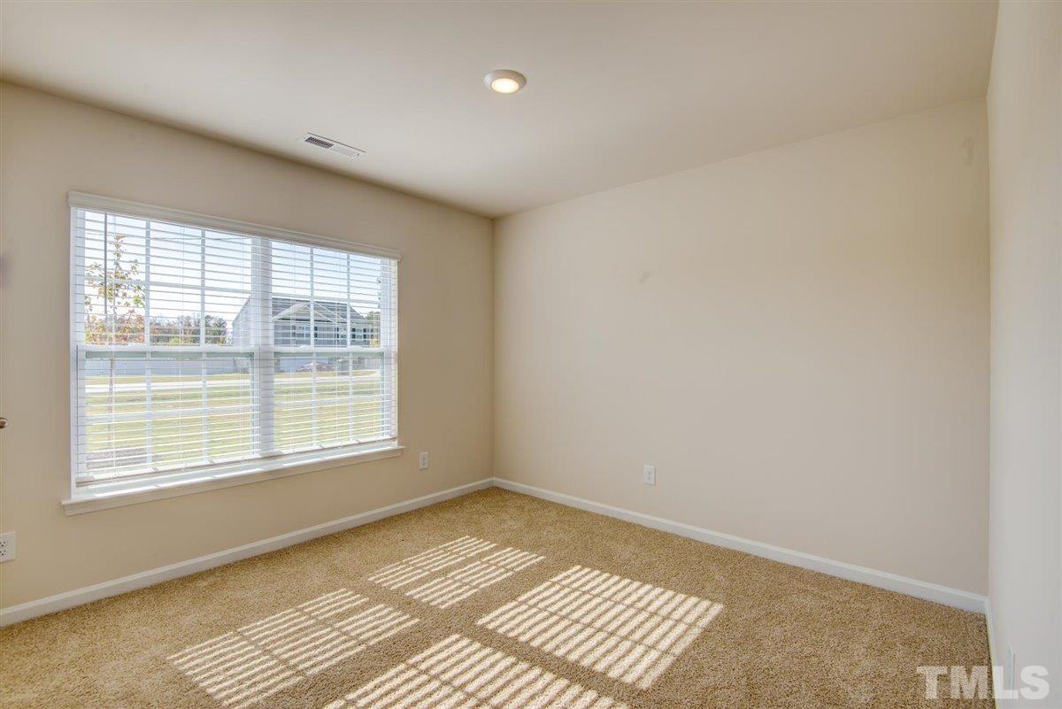 7653 Sand Pit Road Stantonsburg, NC 27883 - Photo 3 of 28 a view of an empty room with a window