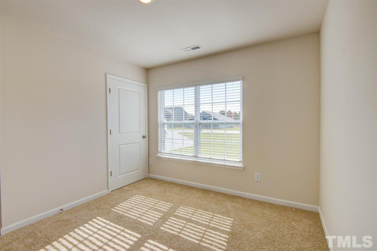7653 Sand Pit Road Stantonsburg, NC 27883 - Photo 4 of 28 a view of an empty room with a window