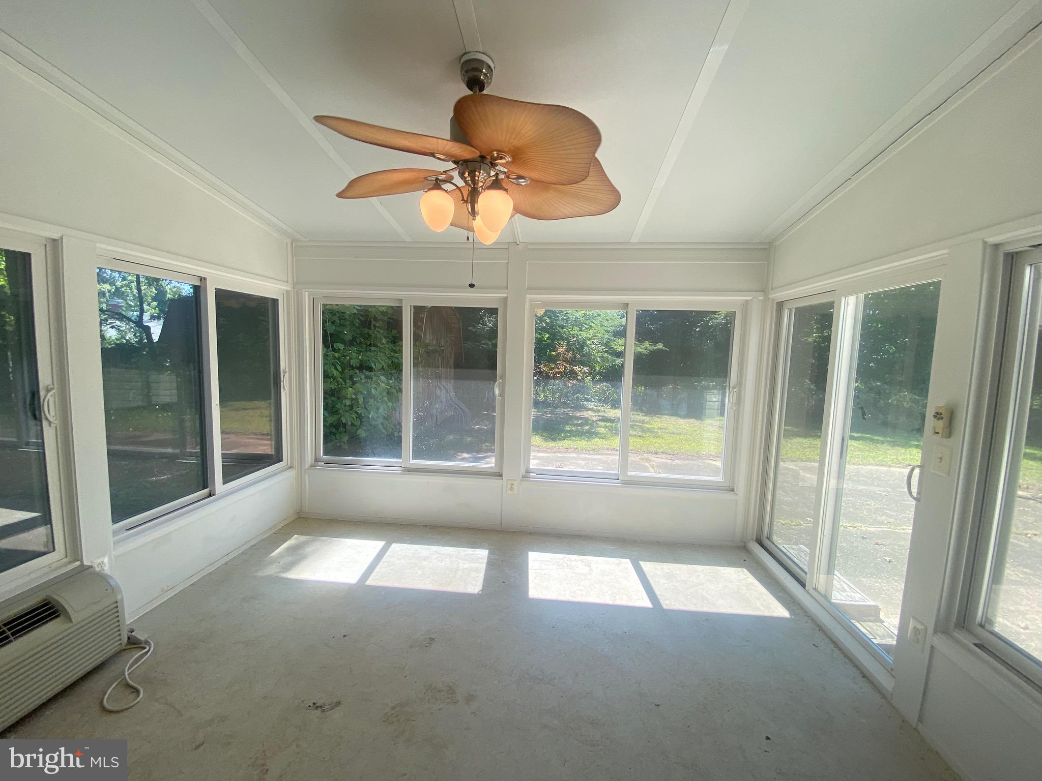 2703 Lyn Place Bowie, MD 20715 - Photo 6 of 14 a view of a livingroom with a ceiling fan and window