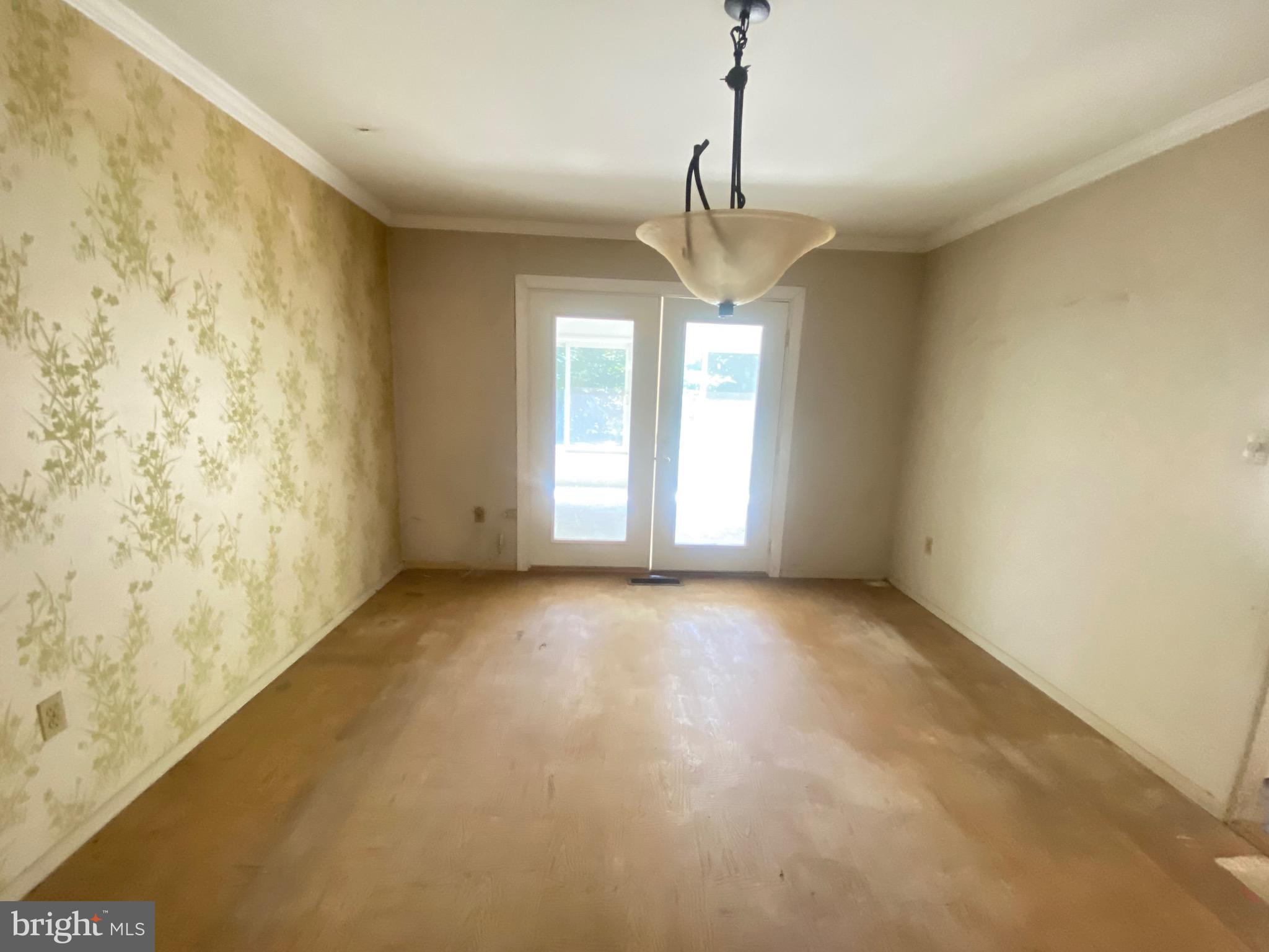 2703 Lyn Place Bowie, MD 20715 - Photo 7 of 14 a view of a big room with windows and chandelier