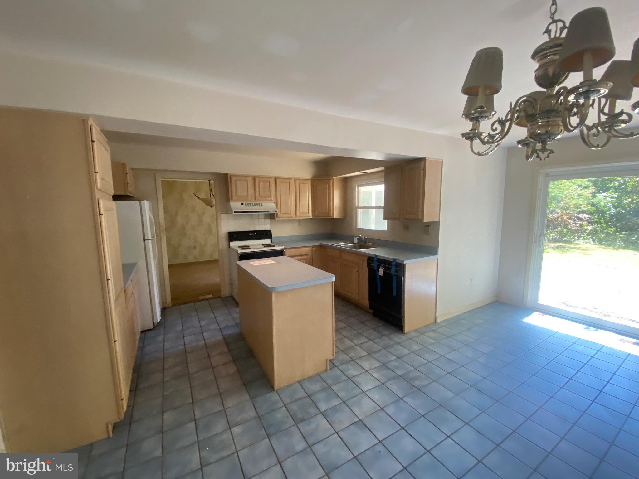 2703 Lyn Place Bowie, MD 20715 - Photo 9 of 14 a kitchen with stainless steel appliances granite countertop a sink a stove and a refrigerator