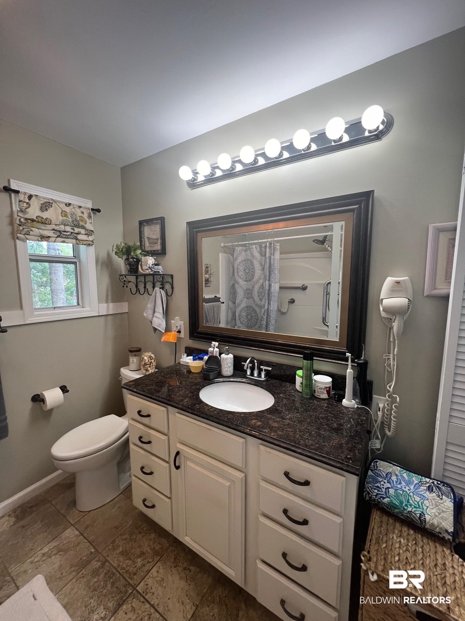 168 Defuniak Loop Lillian, AL 36549 - Photo 5 of 28 Bathroom with vanity, tile patterned flooring, and toilet