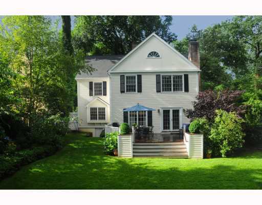 Undisclosed Address Riverside, CT 06878 - Photo 2 of 2 a front view of a house with a garden