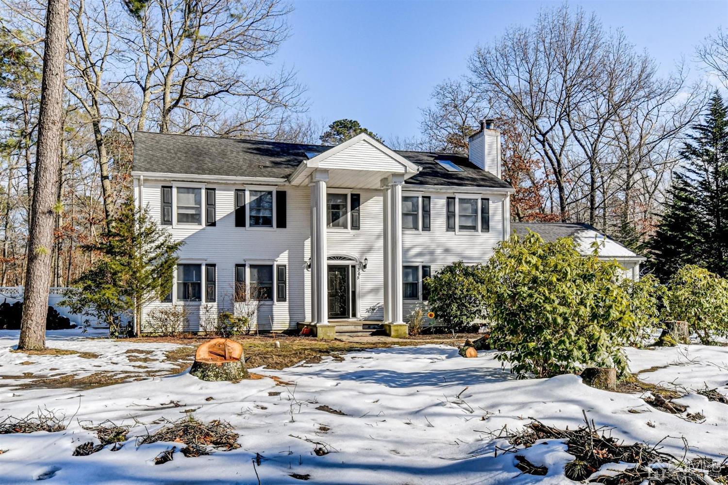 365 Cedar Swamp Road Jackson, NJ 08527 - Photo 2 of 38 a front view of a house with a yard and trees