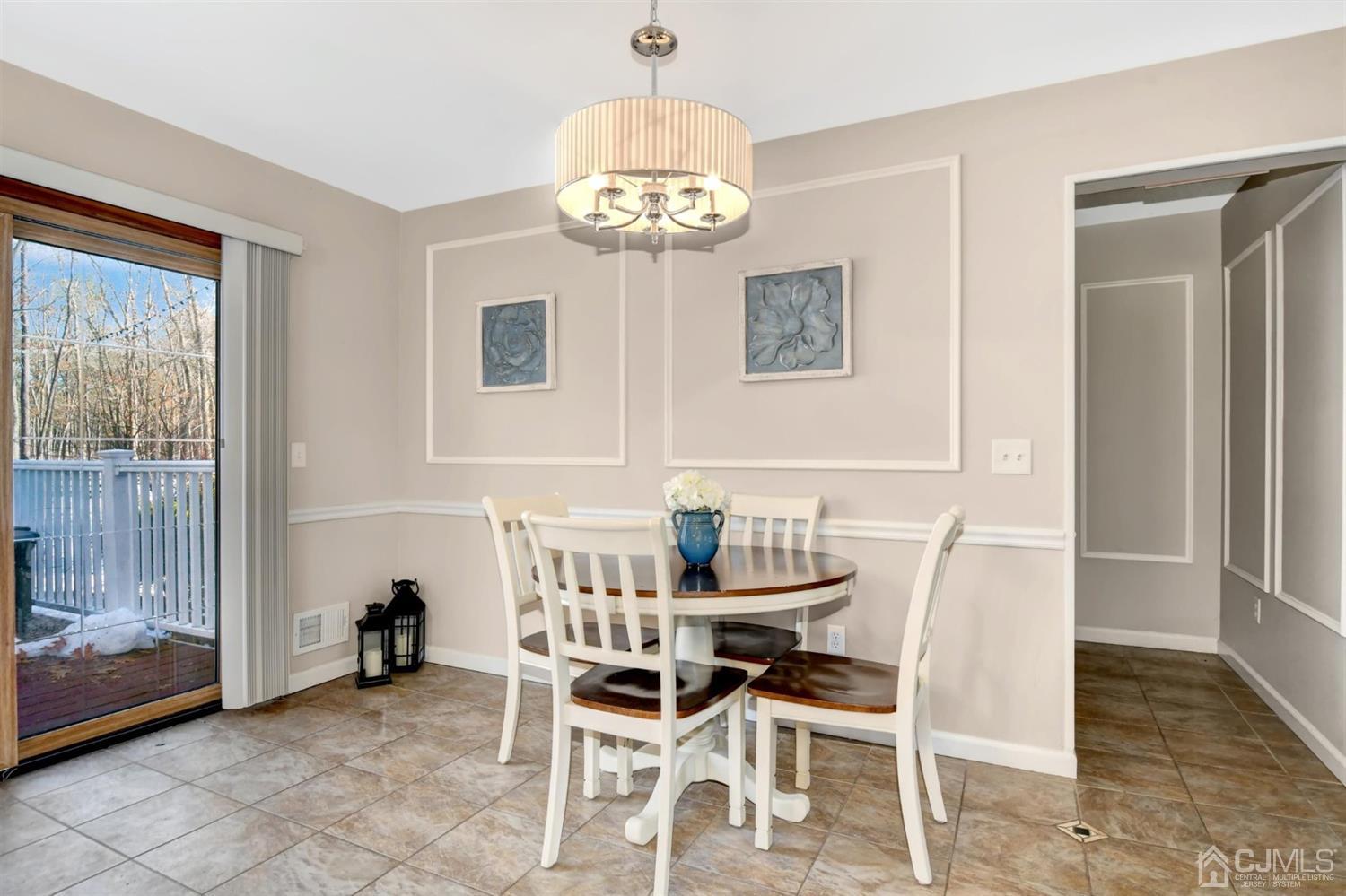 365 Cedar Swamp Road Jackson, NJ 08527 - Photo 14 of 38 a view of a dining room with furniture and chandelier
