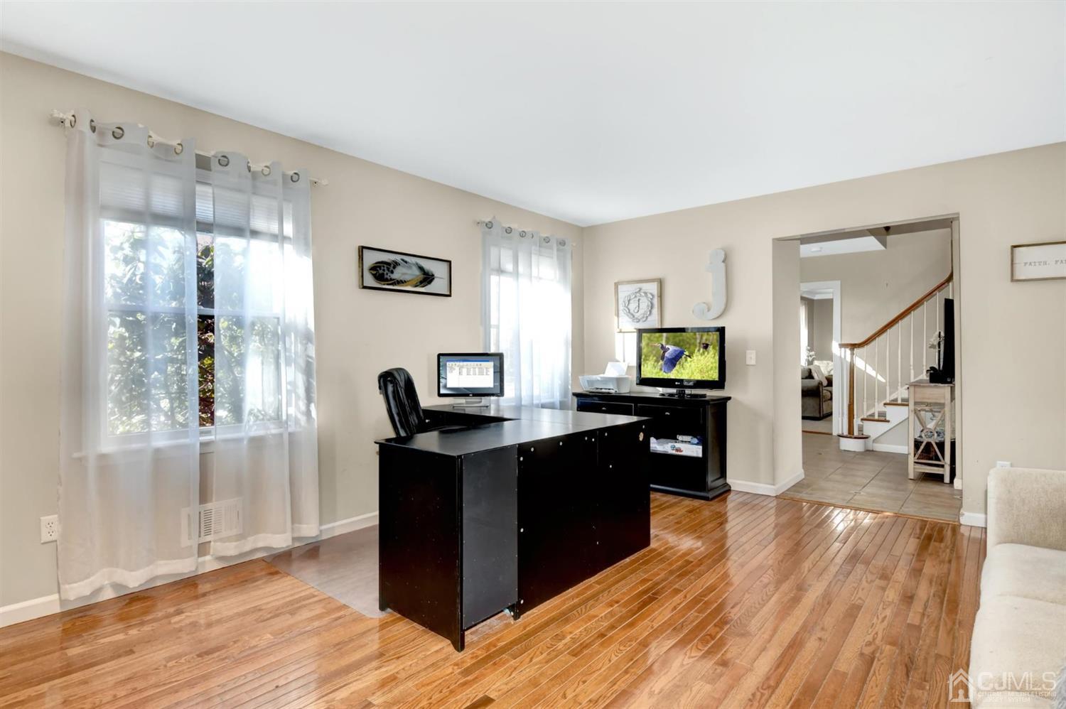 365 Cedar Swamp Road Jackson, NJ 08527 - Photo 16 of 38 a view of a workspace with furniture and wooden floor