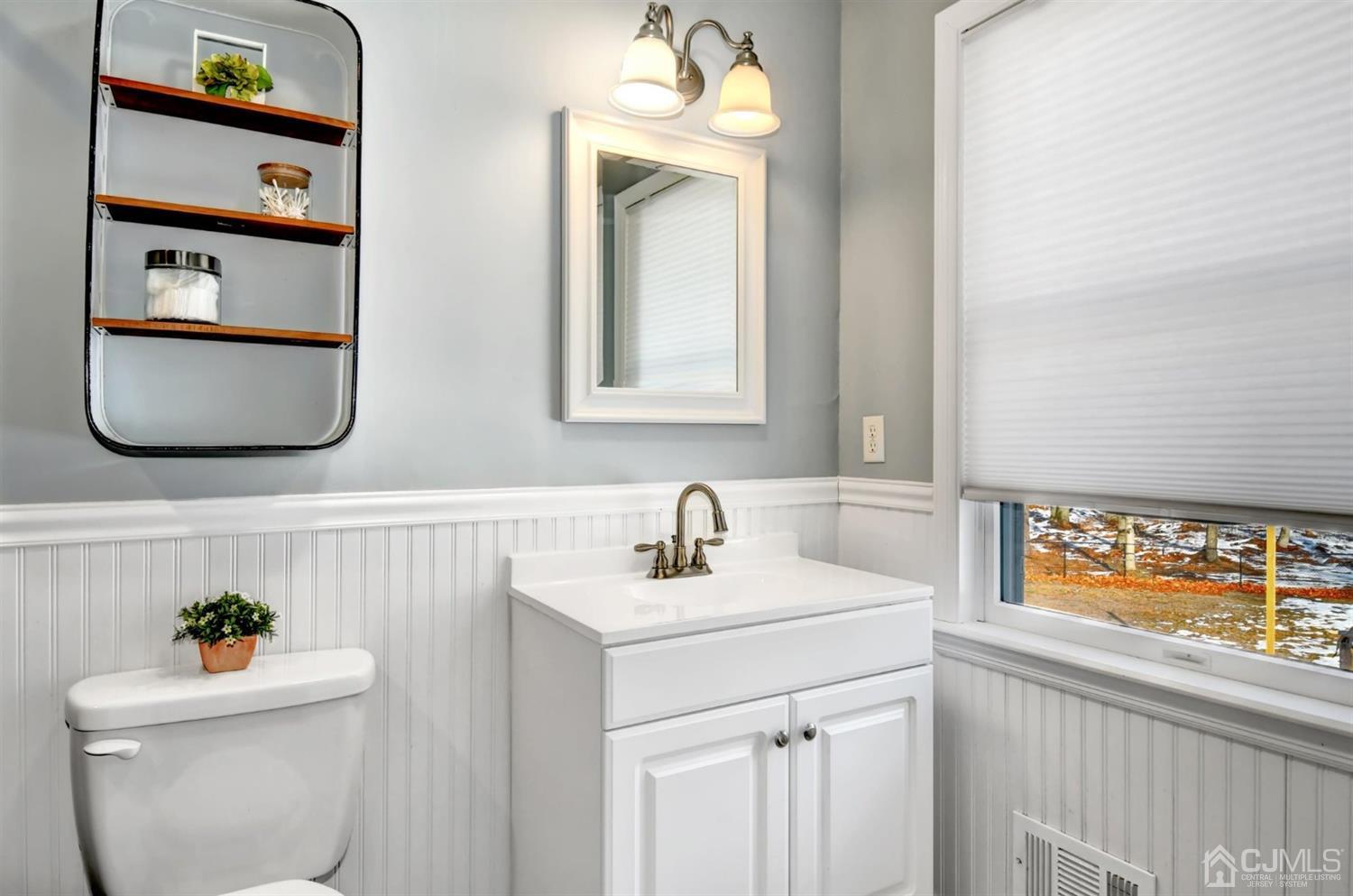 365 Cedar Swamp Road Jackson, NJ 08527 - Photo 19 of 38 a bathroom with a sink a mirror and a toilet