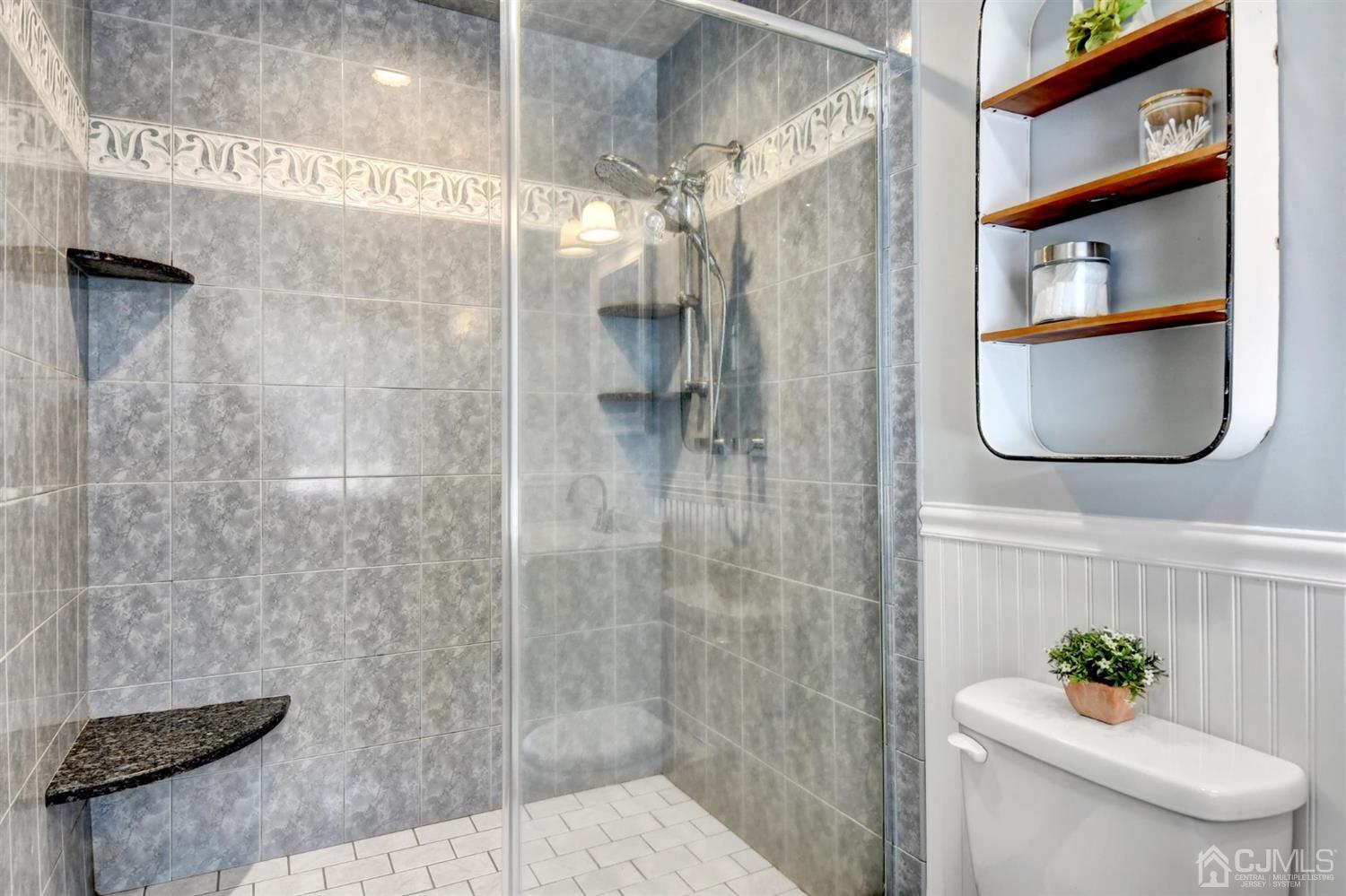 365 Cedar Swamp Road Jackson, NJ 08527 - Photo 20 of 38 a bathroom with a toilet a sink and shower
