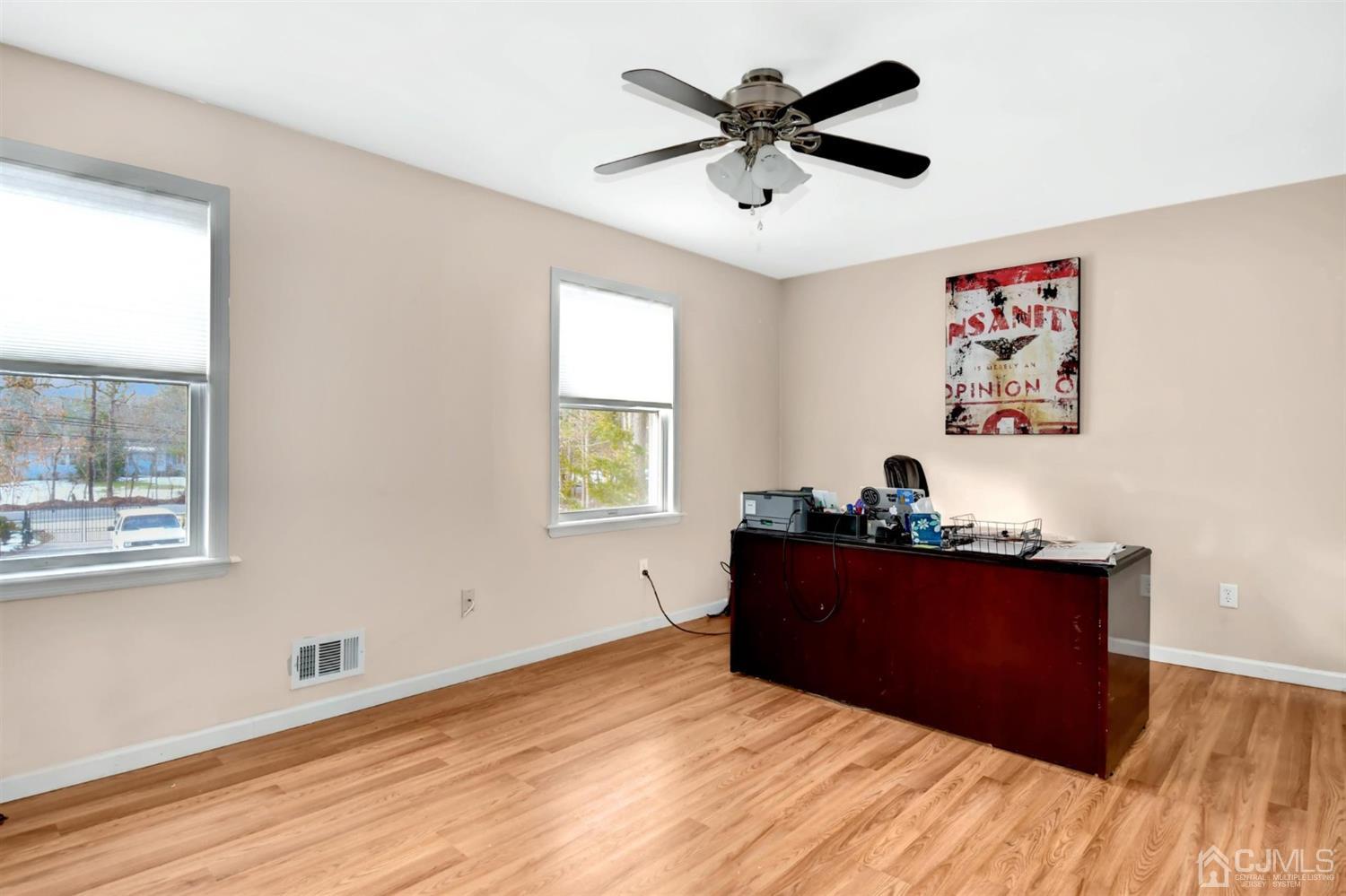 365 Cedar Swamp Road Jackson, NJ 08527 - Photo 25 of 38 a bedroom with a bed and a window