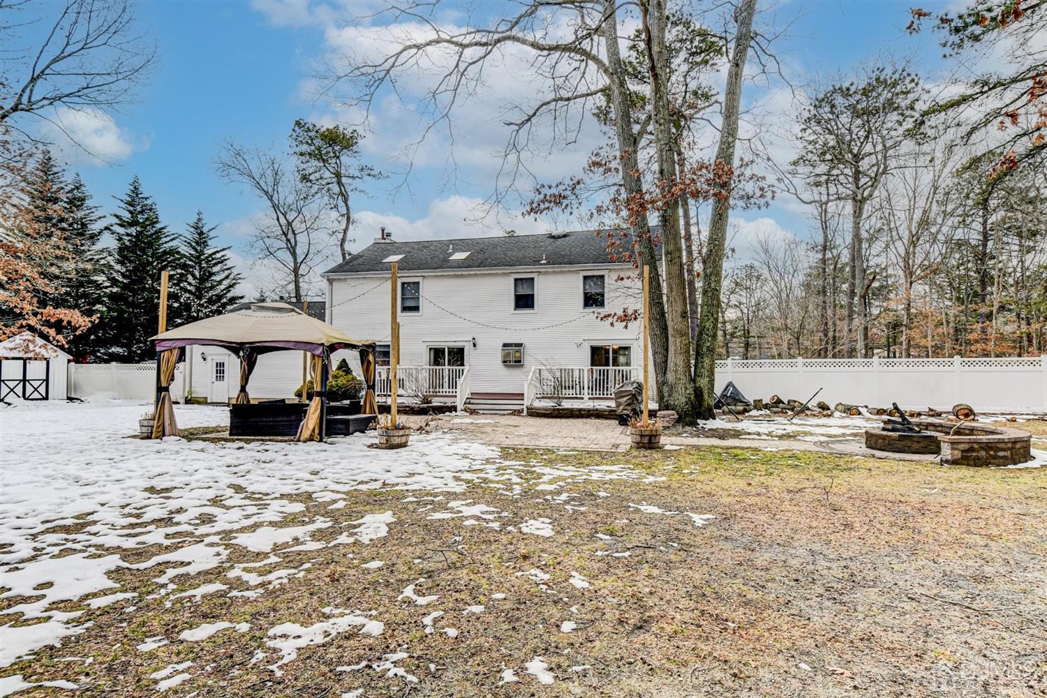 365 Cedar Swamp Road Jackson, NJ 08527 - Photo 28 of 38 a view of a house with a snow in the yard