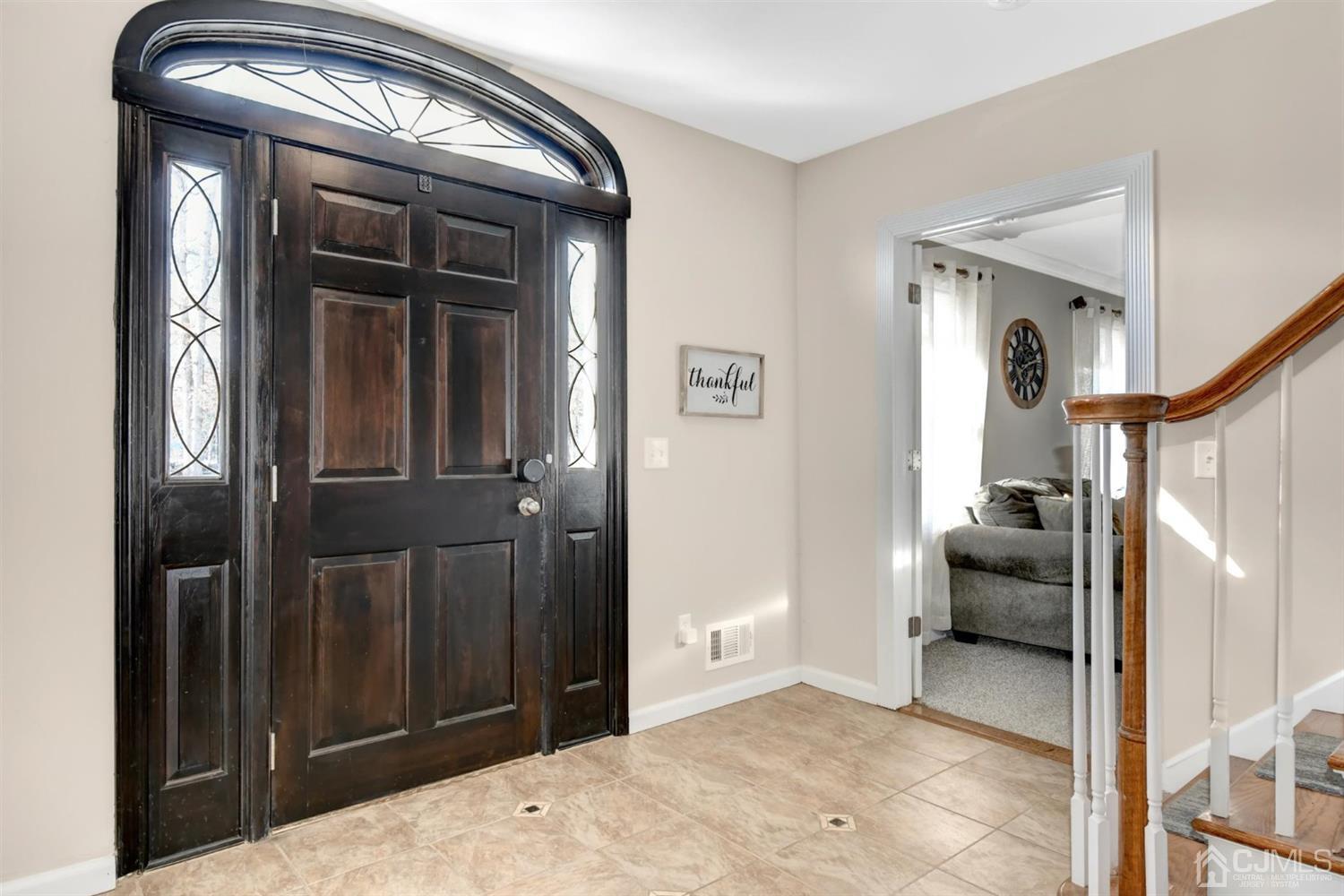 365 Cedar Swamp Road Jackson, NJ 08527 - Photo 5 of 38 a view of hallway with livingroom and stairs