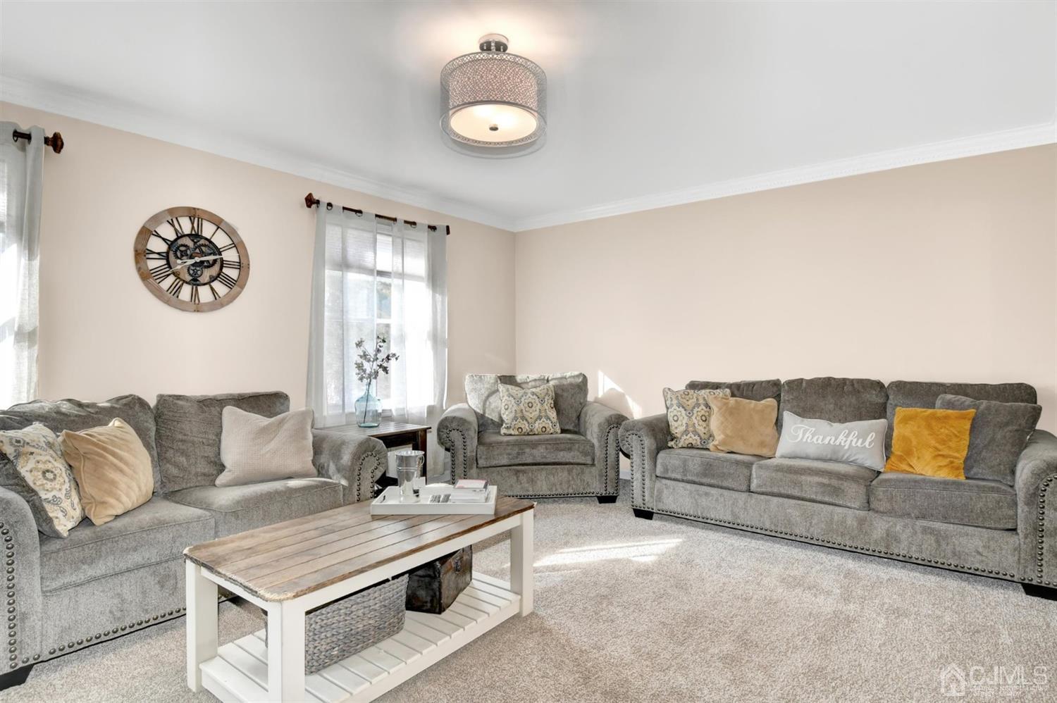 365 Cedar Swamp Road Jackson, NJ 08527 - Photo 7 of 38 a living room with furniture and a large window