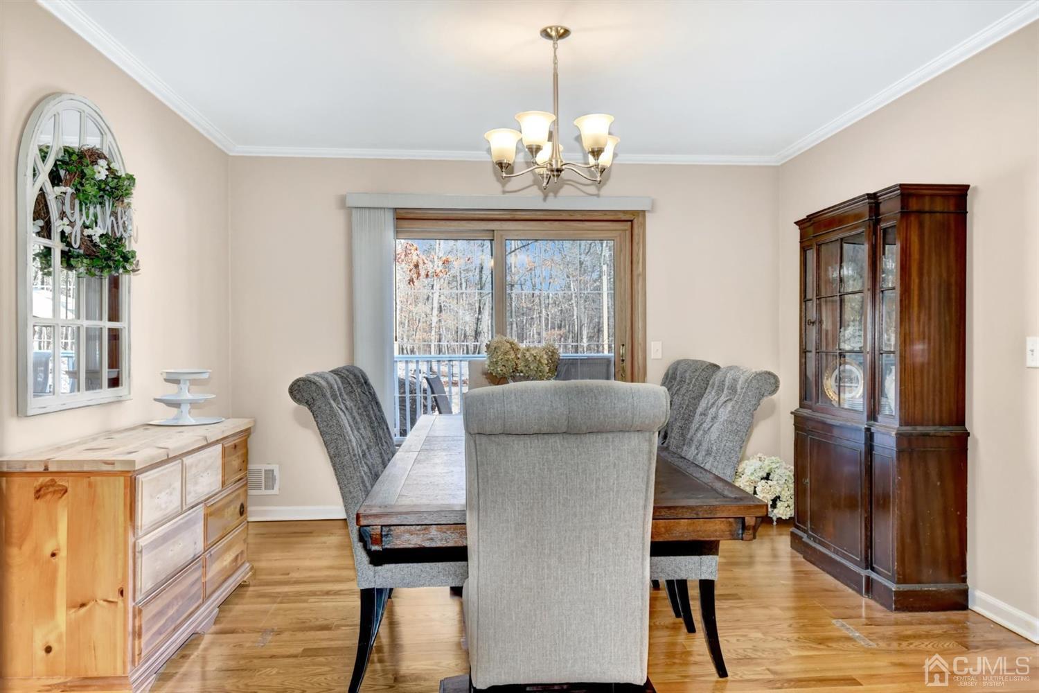 365 Cedar Swamp Road Jackson, NJ 08527 - Photo 9 of 38 a view of a dining room with furniture window and wooden floor