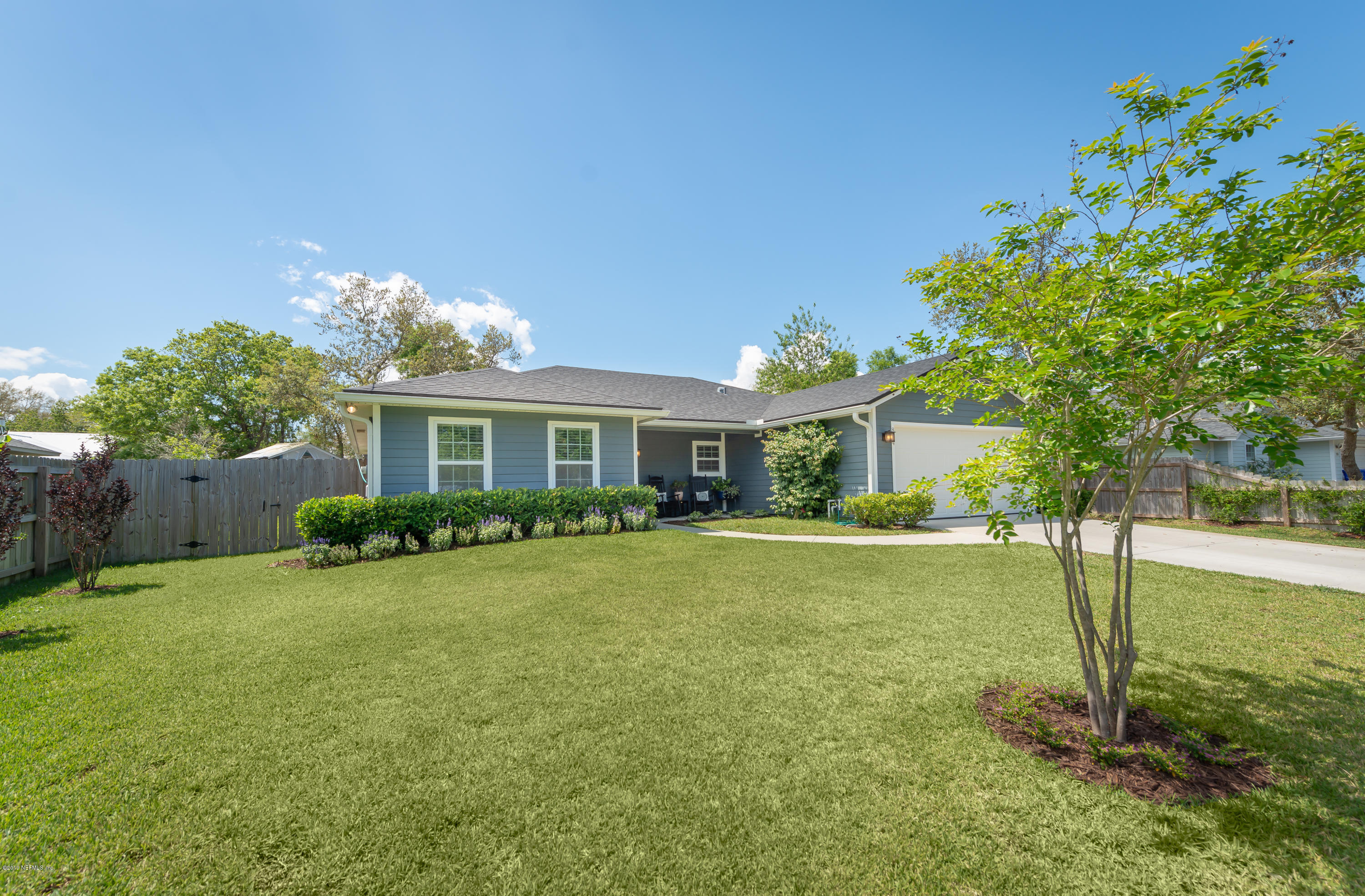824 Queen Road St. Augustine, FL 32086 - Photo 2 of 35 a front view of a house with garden