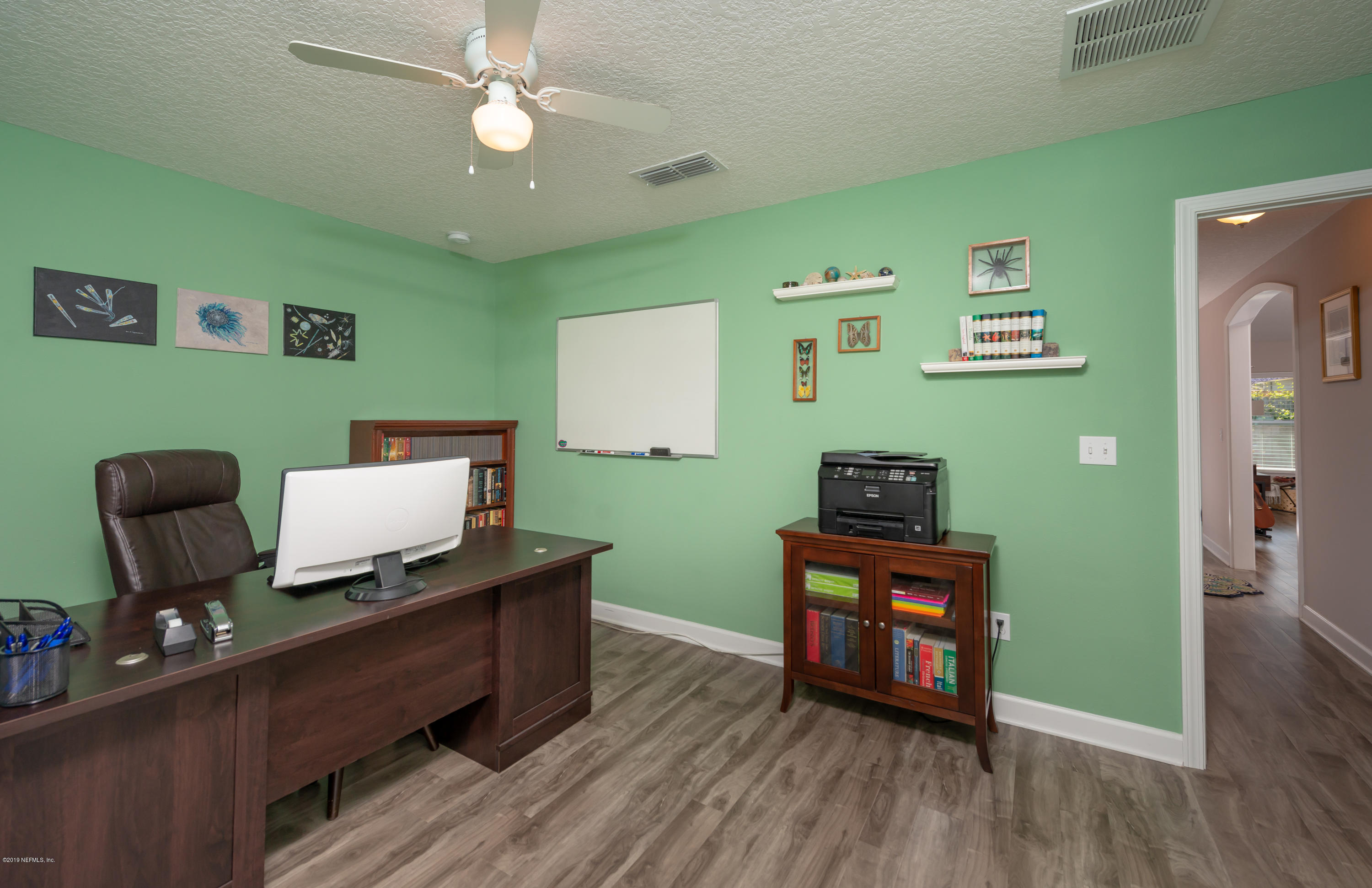 824 Queen Road St. Augustine, FL 32086 - Photo 25 of 35 a living room with furniture and a wooden floor