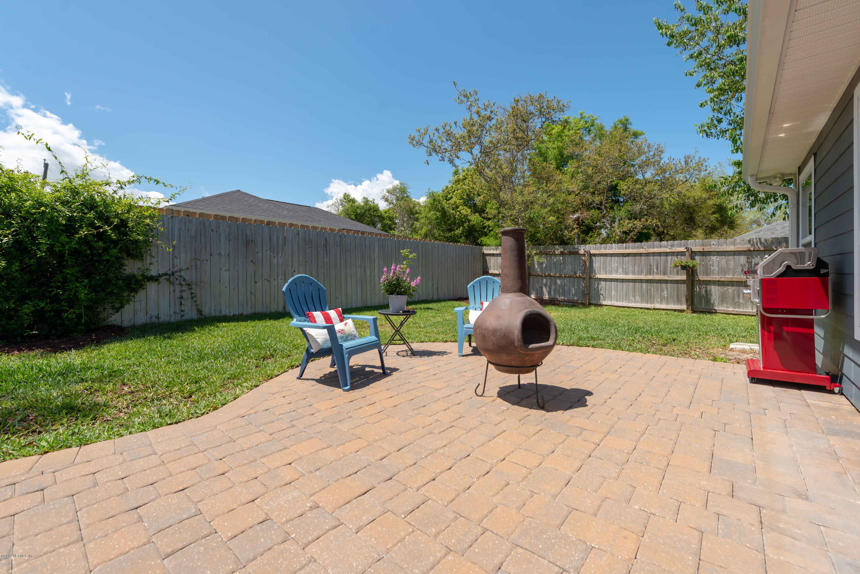 824 Queen Road St. Augustine, FL 32086 - Photo 31 of 35 a view of a backyard with a sitting area