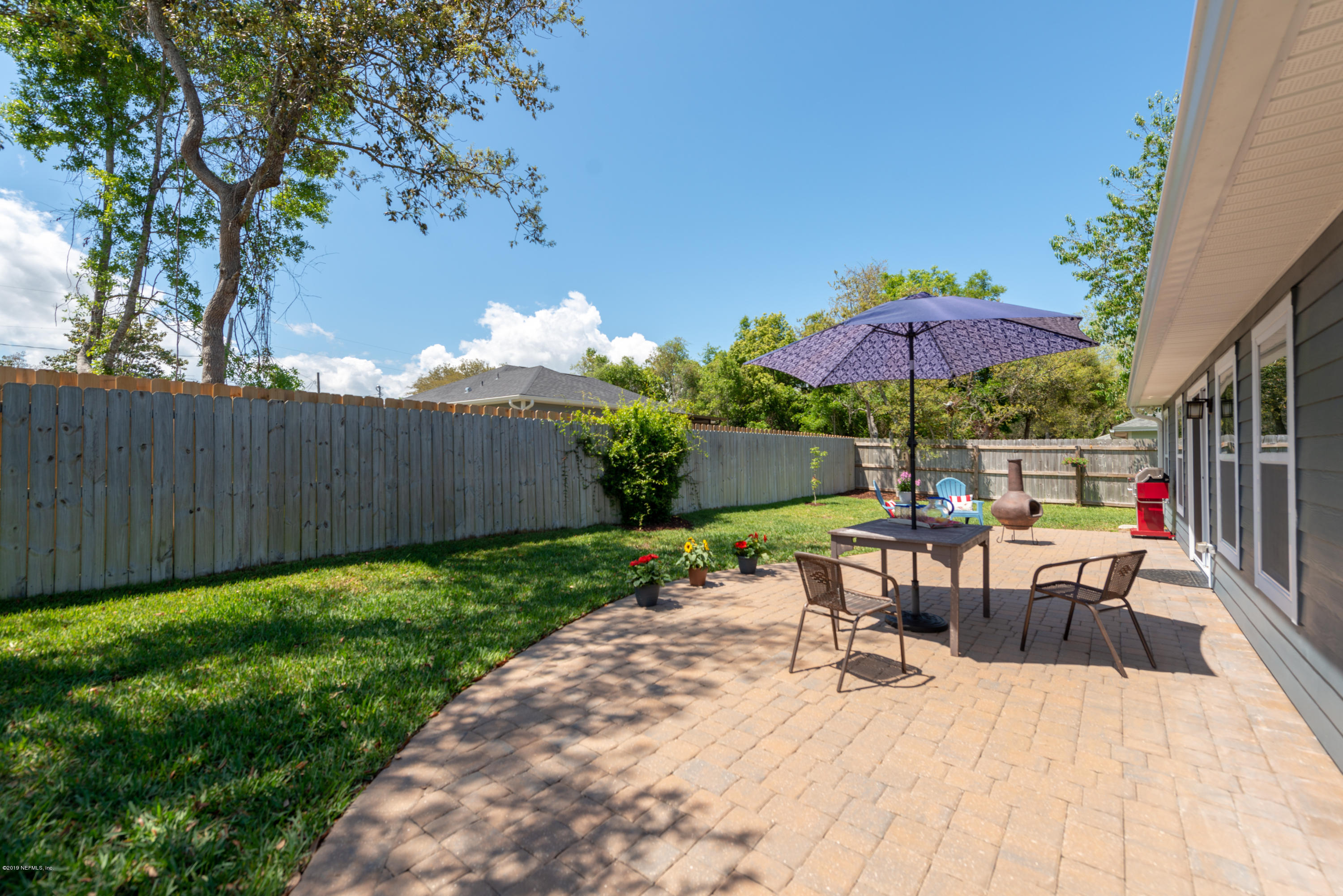 824 Queen Road St. Augustine, FL 32086 - Photo 32 of 35 a view of a backyard with sitting area