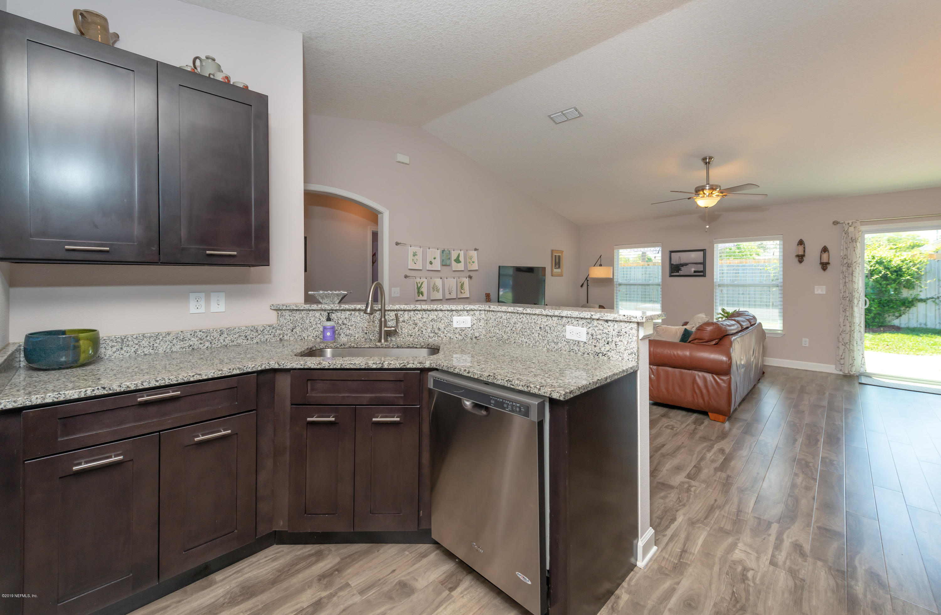 824 Queen Road St. Augustine, FL 32086 - Photo 7 of 35 a kitchen with a sink and cabinets