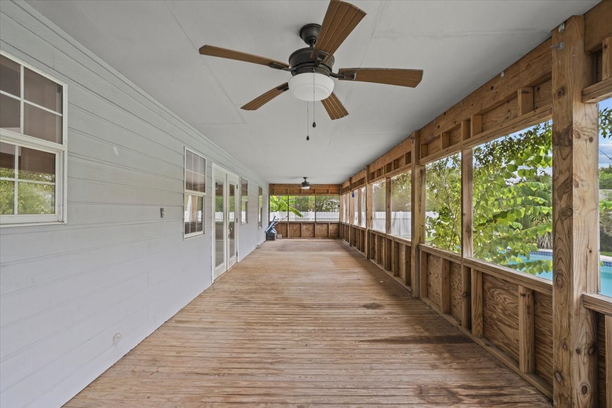 7228 Avenue R Santa Fe, TX 77510 - Photo 39 of 44 Screened in porch runs the length of the house.
