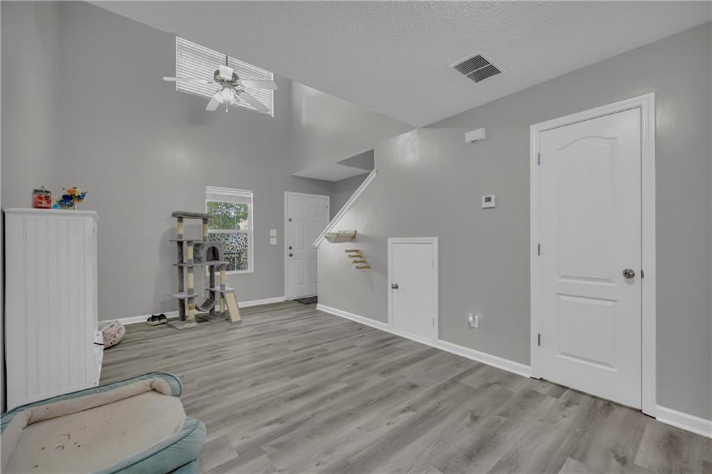1498 Box Circle Winder, GA 30680 - Photo 15 of 56 an empty room with wooden floor and gym equipment
