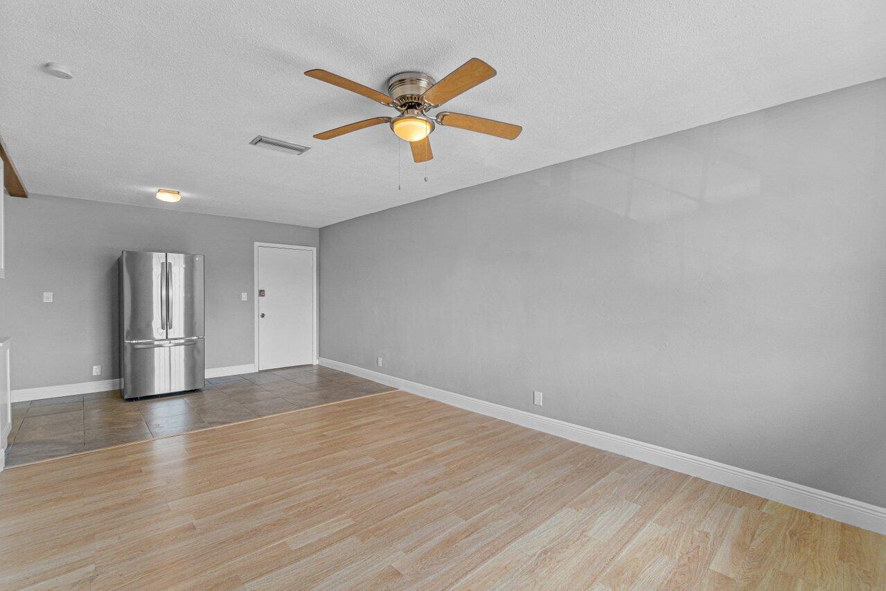 299 Southwest 7th Street, Unit 2060 Boca Raton, FL 33432 - Photo 11 of 20 a view of empty room with wooden floor