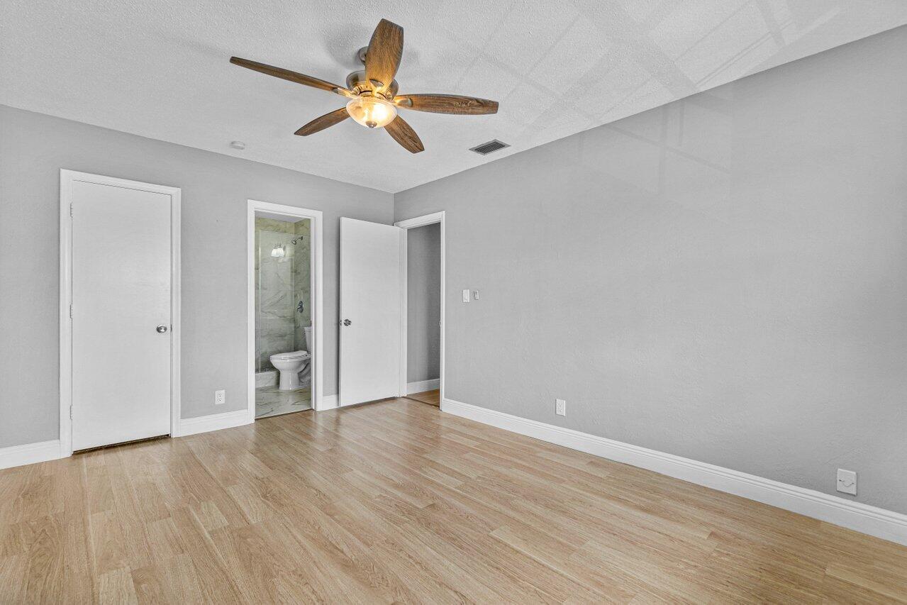 299 Southwest 7th Street, Unit 2060 Boca Raton, FL 33432 - Photo 16 of 20 wooden floor in an empty room