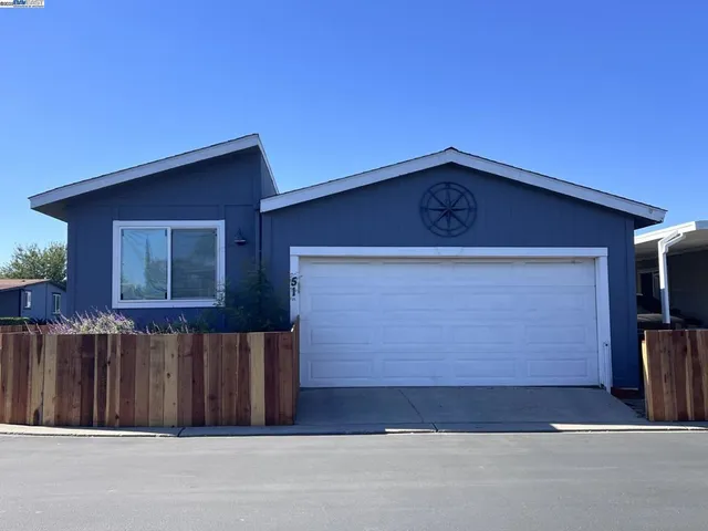 a front view of a house with a garage
