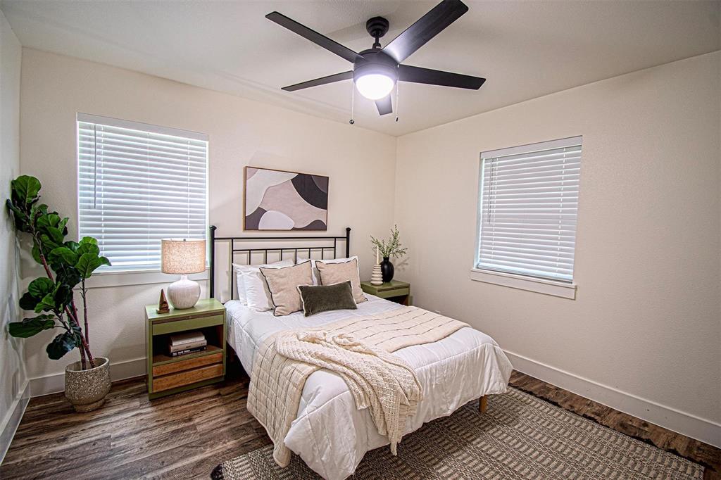 551 East Burks Street Pilot Point, TX 76258 - Photo 20 of 29 a bedroom with bed and wooden floor