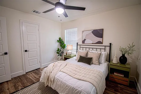 a bedroom with a bed and window