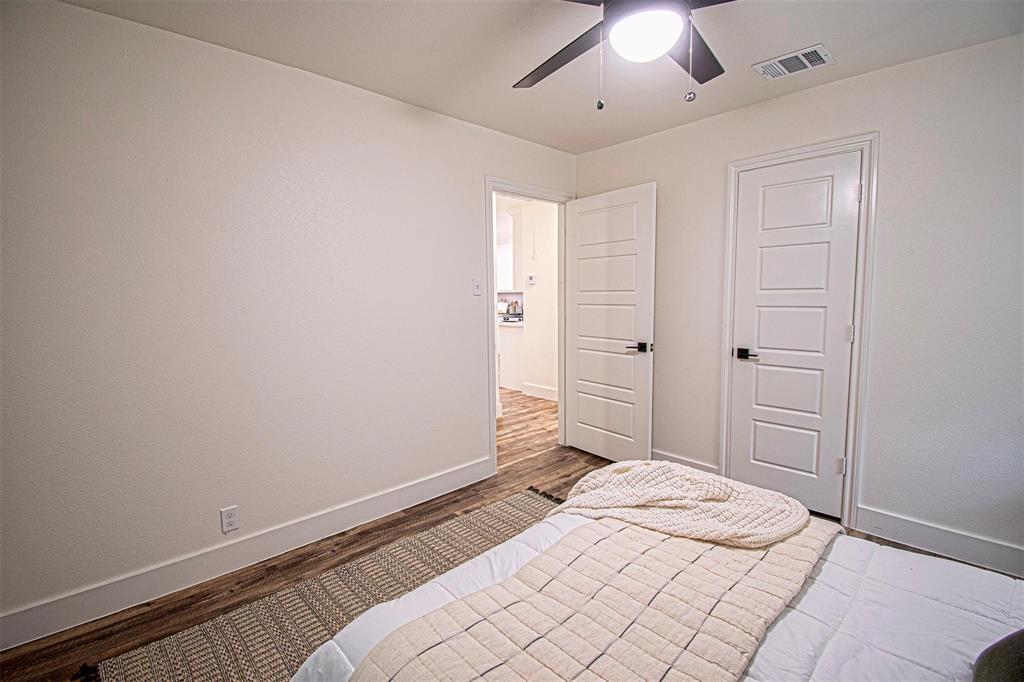 551 East Burks Street Pilot Point, TX 76258 - Photo 23 of 29 a bedroom with a bed and a window