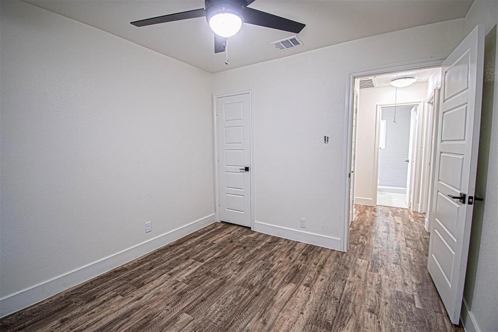 551 East Burks Street Pilot Point, TX 76258 - Photo 25 of 29 a view of an empty room with wooden floor