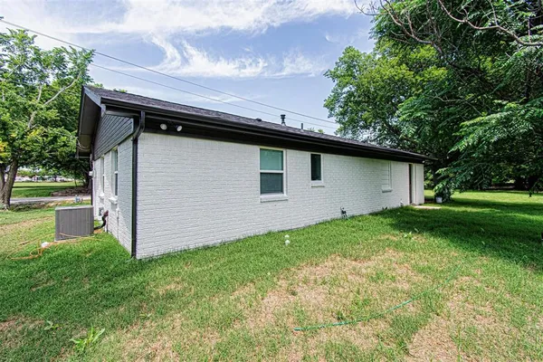 a backyard of a house with lots of green space