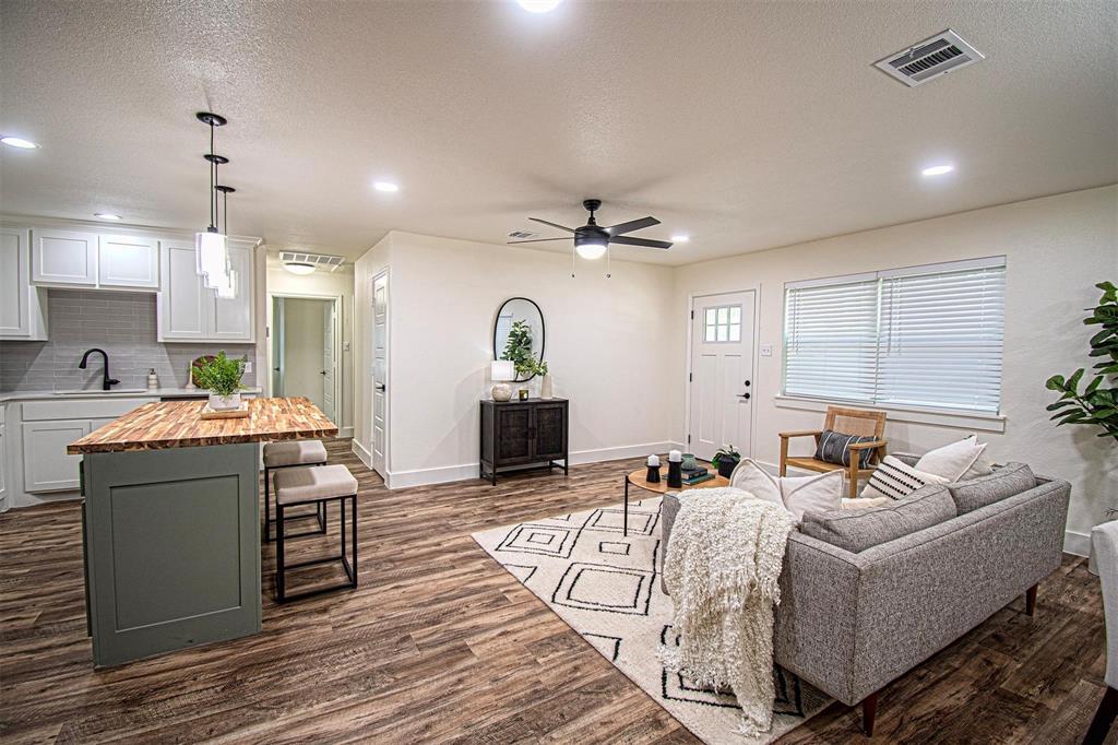551 East Burks Street Pilot Point, TX 76258 - Photo 5 of 29 a living room with furniture and a wooden floor