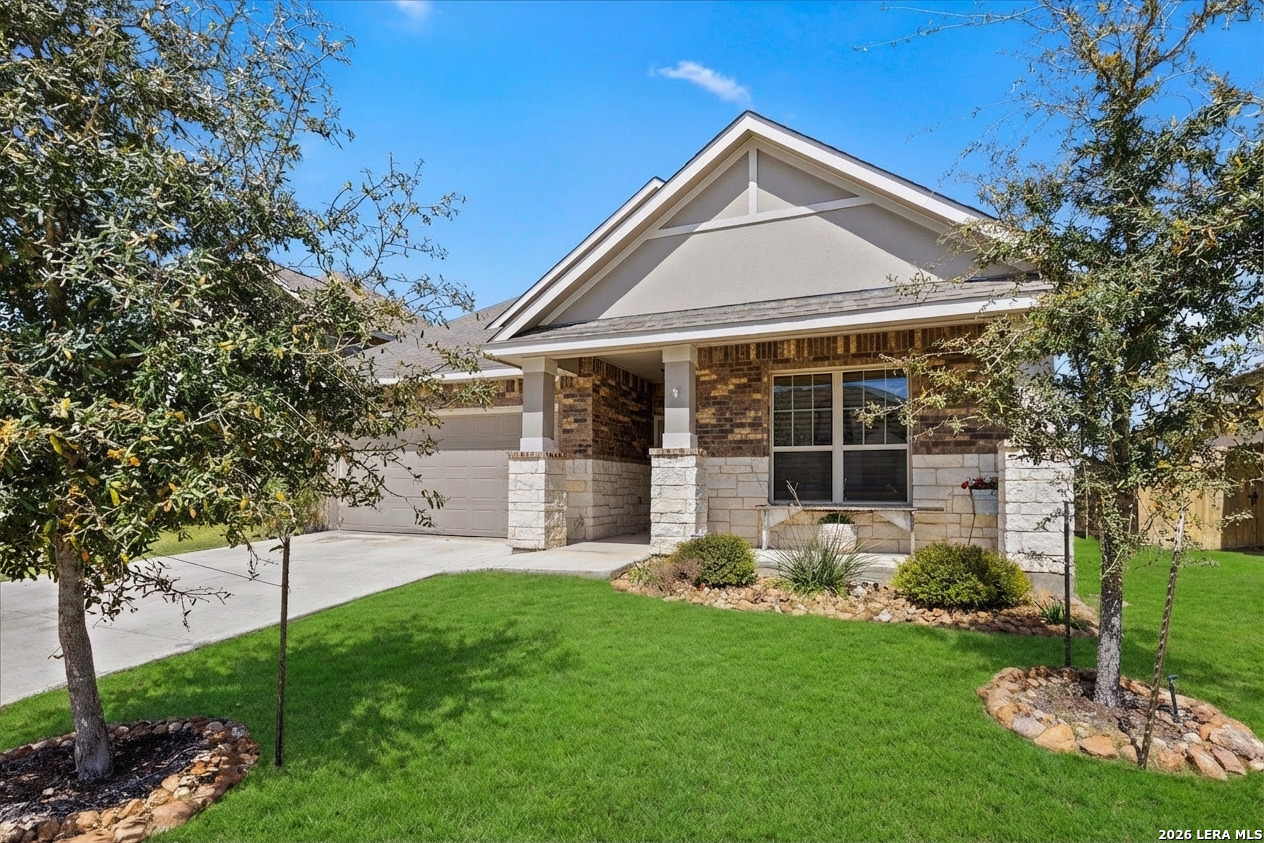 29739 Elkhorn Ridge Fair Oaks Ranch, TX 78015 - Photo 1 of 47 a front view of a house with garden and porch