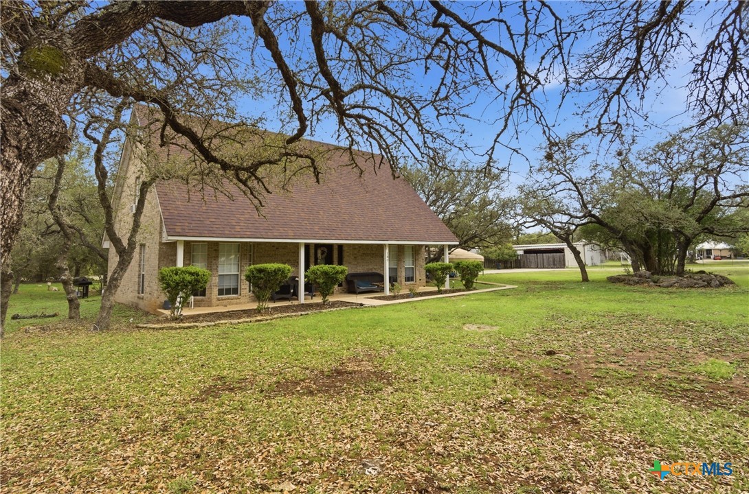 642 Phantom Rider Trail Spring Branch, TX 78070 - Photo 34 of 41 a front view of a house with a yard