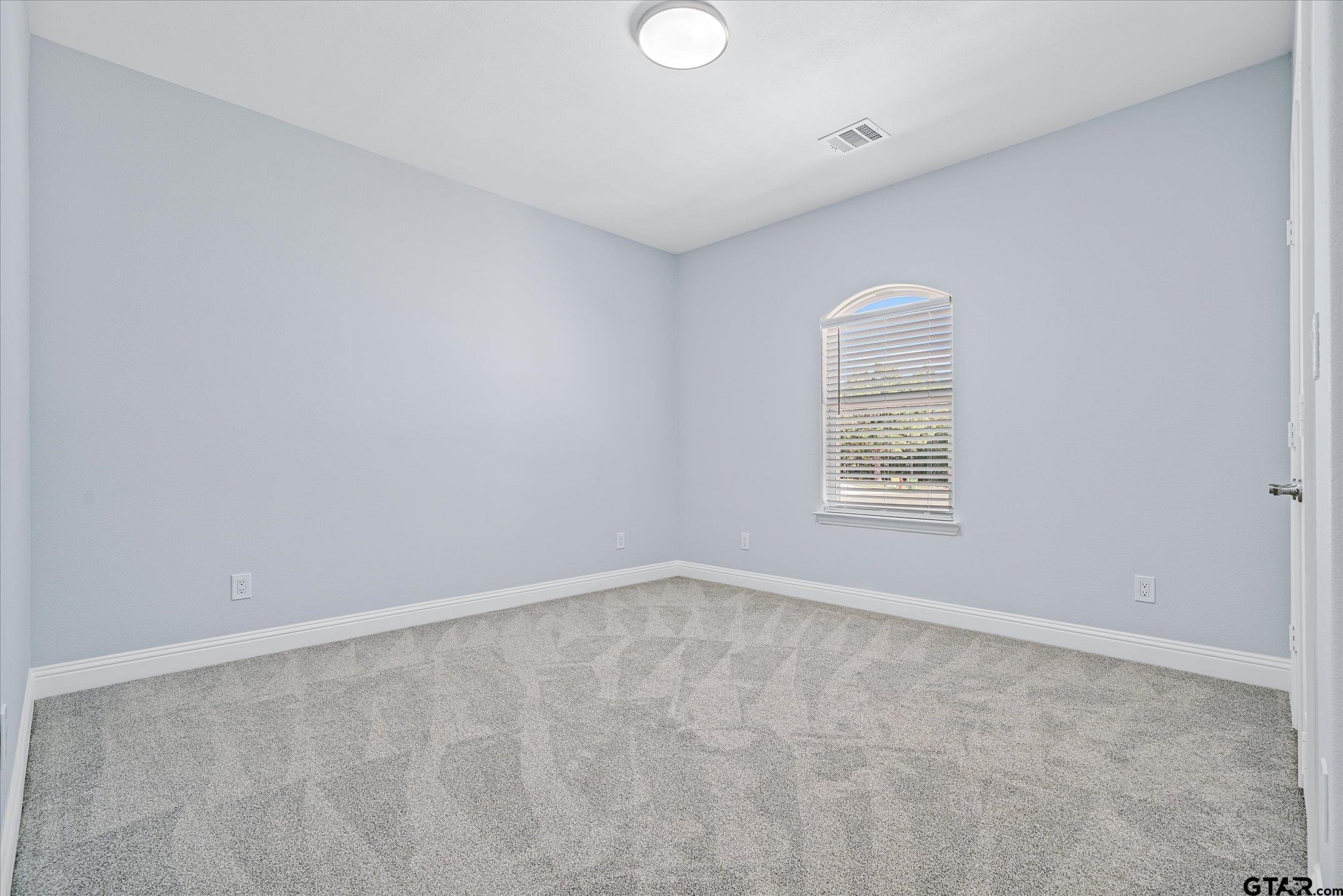 581 Imagine Drive Lindale, TX 75771 - Photo 22 of 35 an empty room with windows