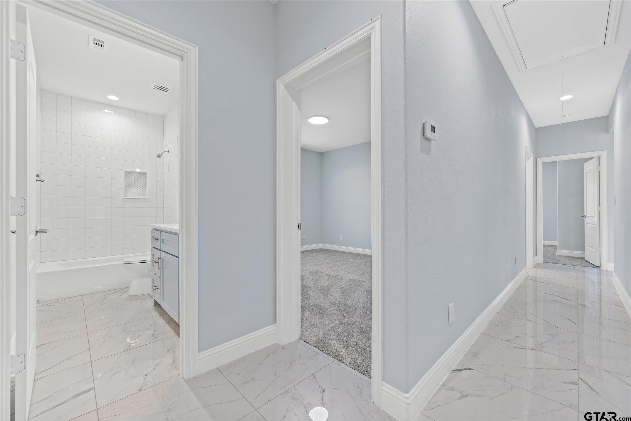 581 Imagine Drive Lindale, TX 75771 - Photo 23 of 35 a bathroom with a shower and a sink