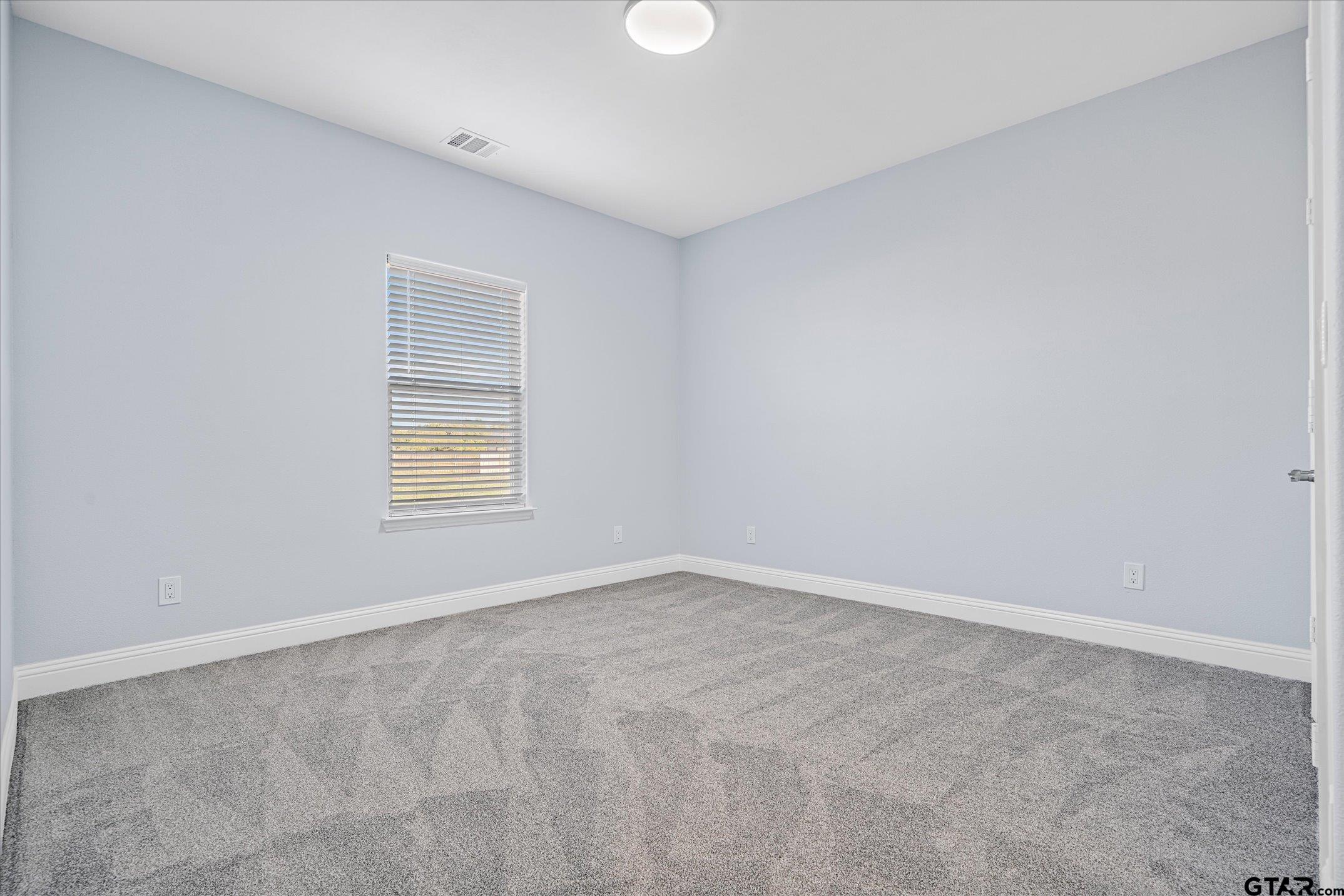 581 Imagine Drive Lindale, TX 75771 - Photo 24 of 35 an empty room with windows