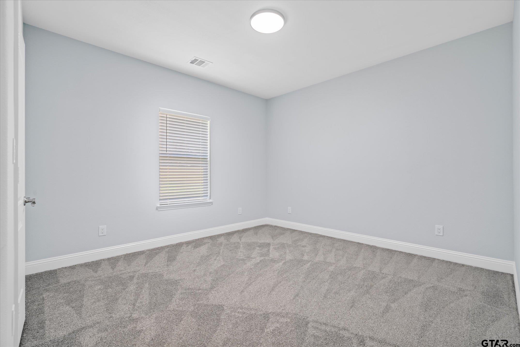 581 Imagine Drive Lindale, TX 75771 - Photo 26 of 35 an empty room with a window