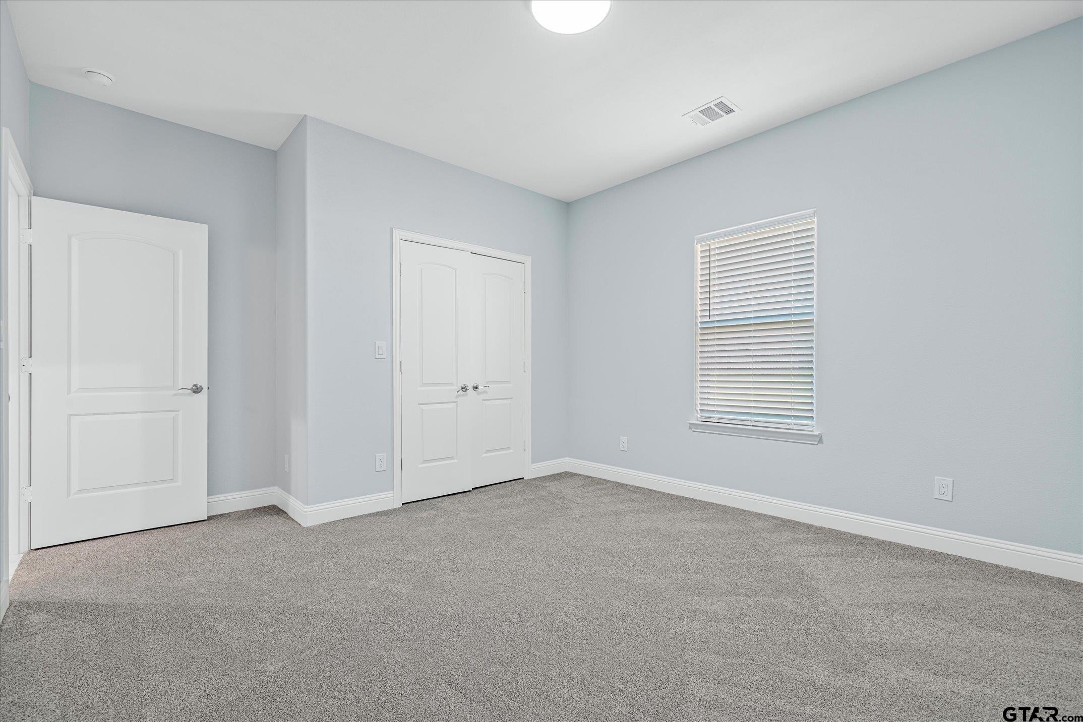 581 Imagine Drive Lindale, TX 75771 - Photo 27 of 35 a view of an empty room with a window