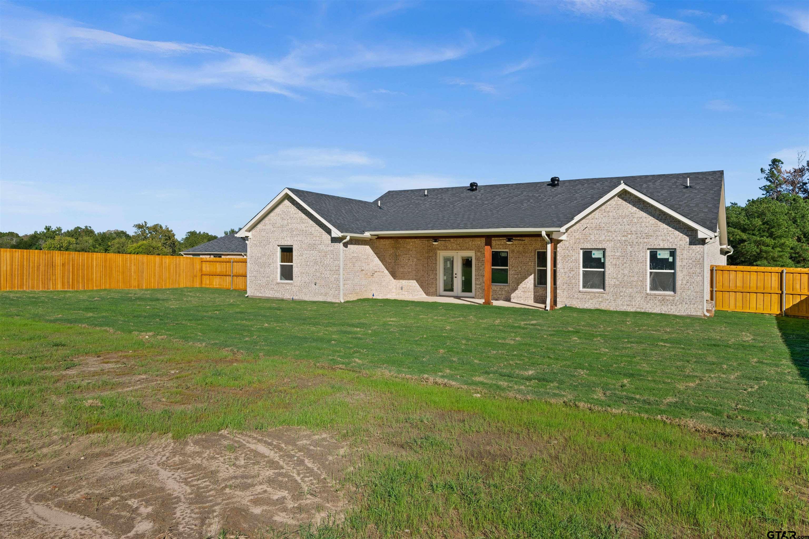 581 Imagine Drive Lindale, TX 75771 - Photo 30 of 35 a view of a yard in front of a house with a yard