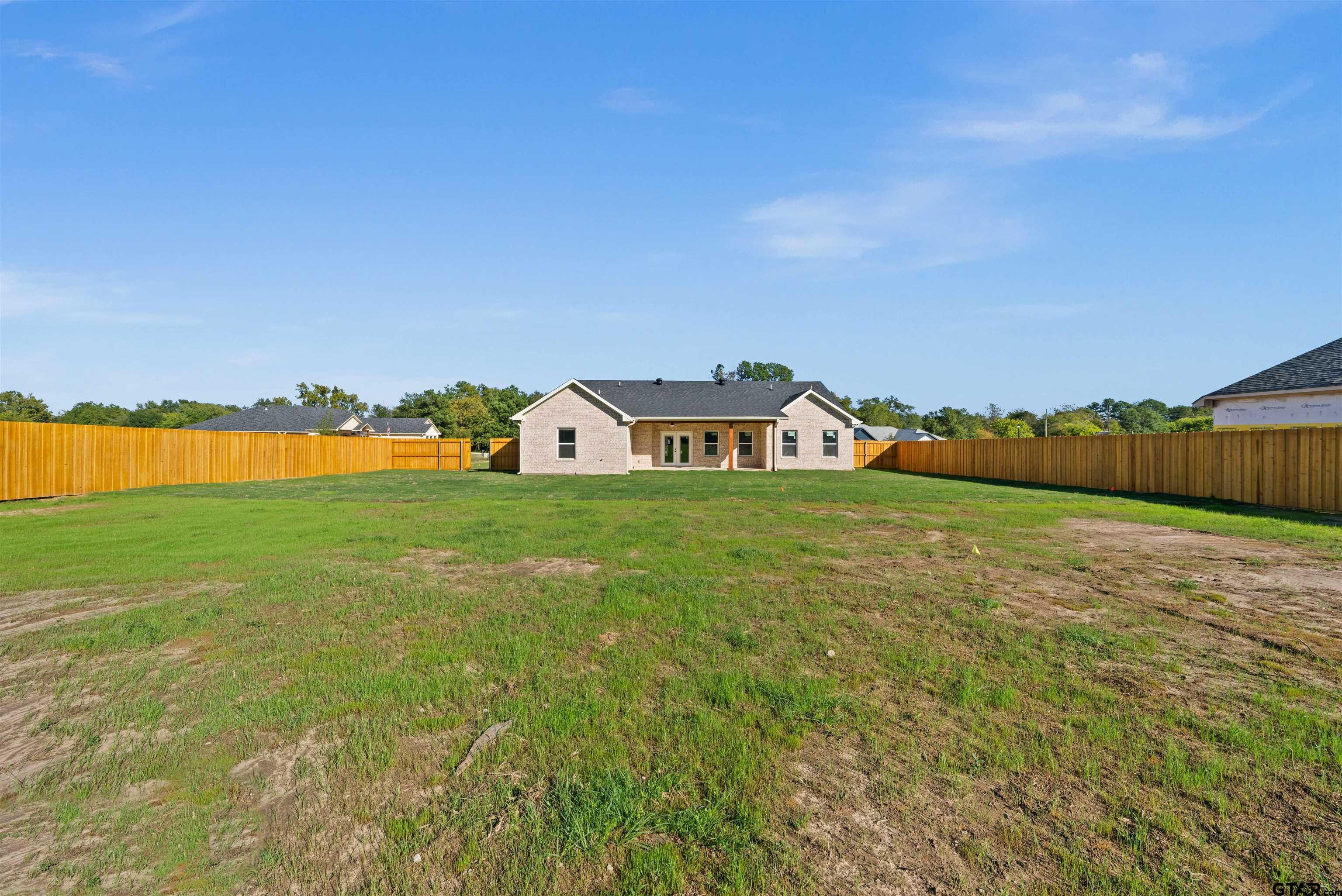 581 Imagine Drive Lindale, TX 75771 - Photo 31 of 35 a view of a houses with a yard