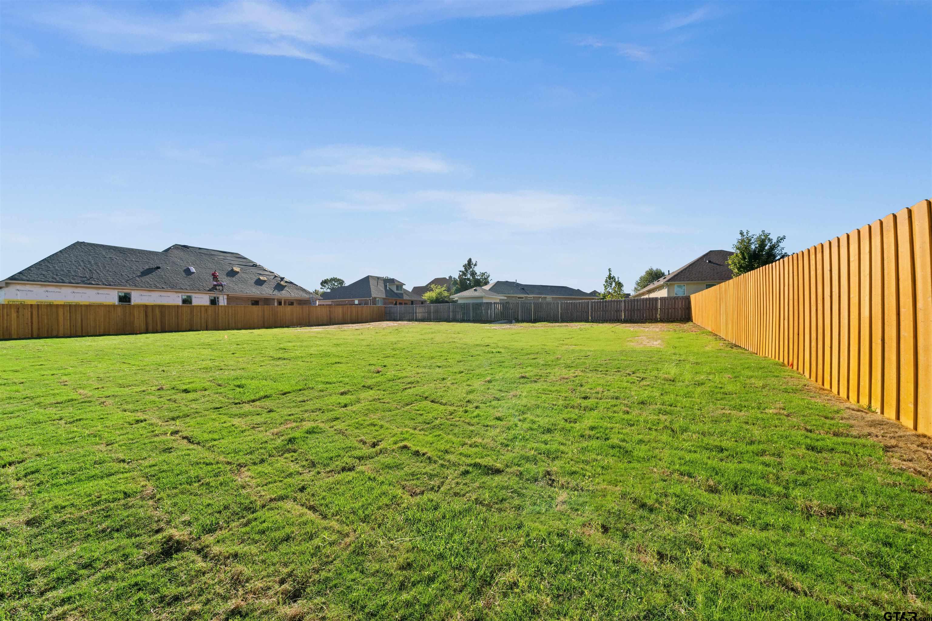 581 Imagine Drive Lindale, TX 75771 - Photo 32 of 35 a view of a large body of water with a building in the background