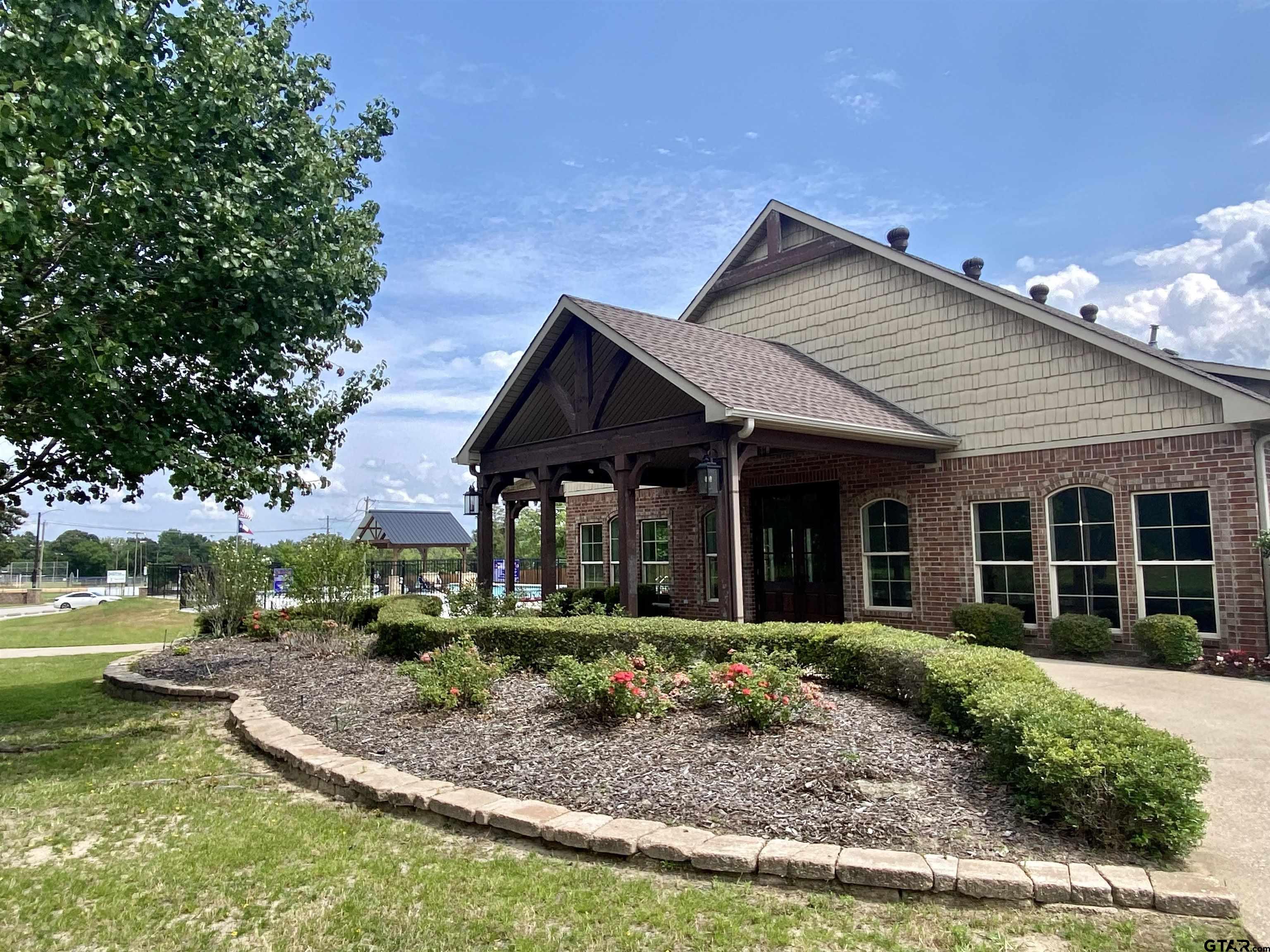 581 Imagine Drive Lindale, TX 75771 - Photo 34 of 35 a front view of a house with garden