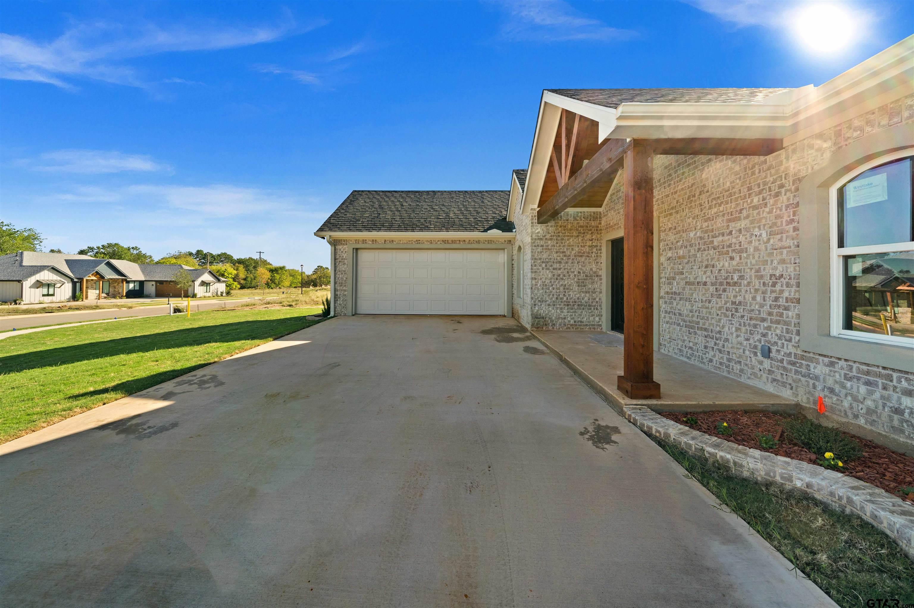 581 Imagine Drive Lindale, TX 75771 - Photo 4 of 35 a view of a house with backyard and sitting area
