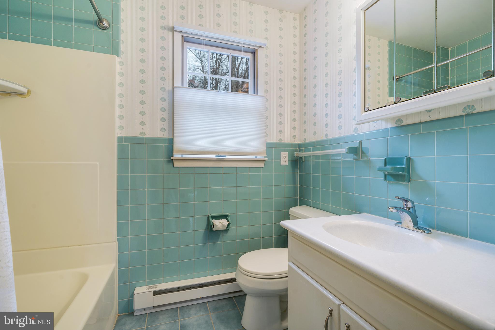 169 East Mountain Road Hillsborough, NJ 08844 - Photo 18 of 29 a bathroom with a toilet sink and mirror