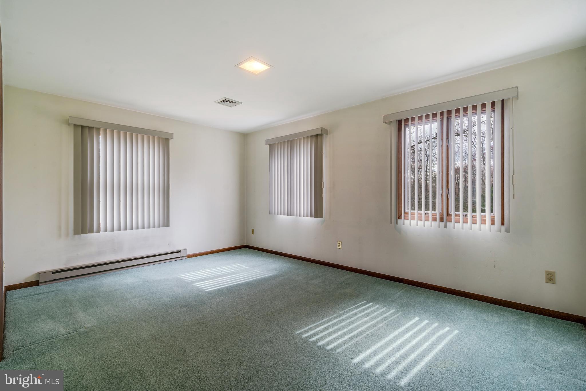 169 East Mountain Road Hillsborough, NJ 08844 - Photo 19 of 29 a view of an empty room with windows